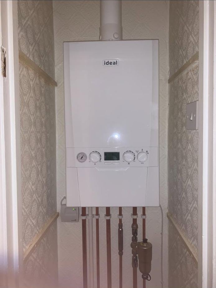 New Ideal boiler fitted in a cupboard