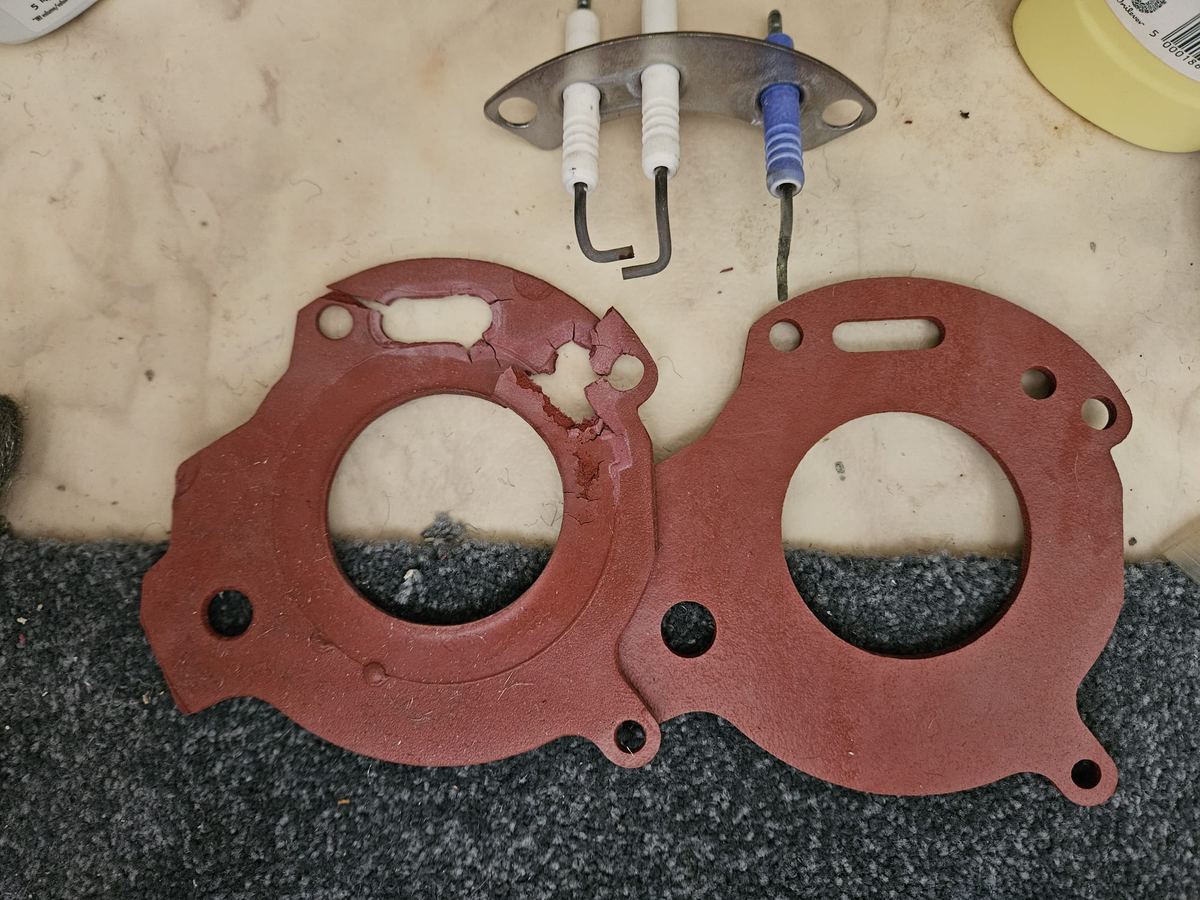 Worn burner gaskets removed during a boiler repair